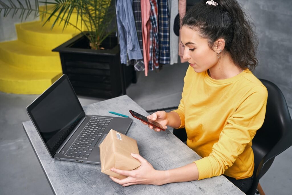 woman scans code parcel using her phone camera